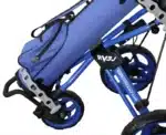 An unfolded Rovic RV3J Junior golf Trolley in Blue carrying a golf bag.