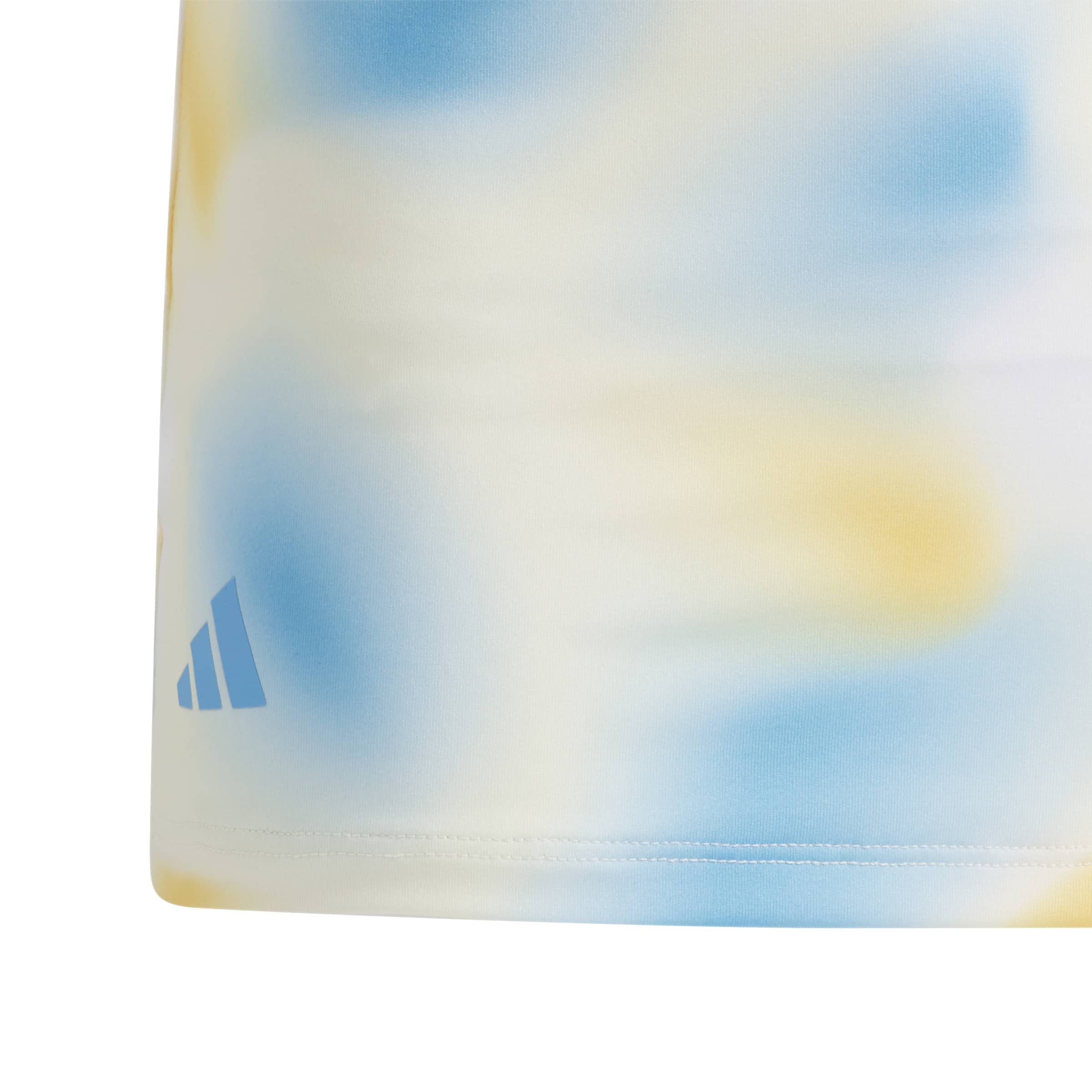 Close up of this girls polo shirt showing the fine adidas detailed 3 stripe logo on the bottom of the polo shirt.