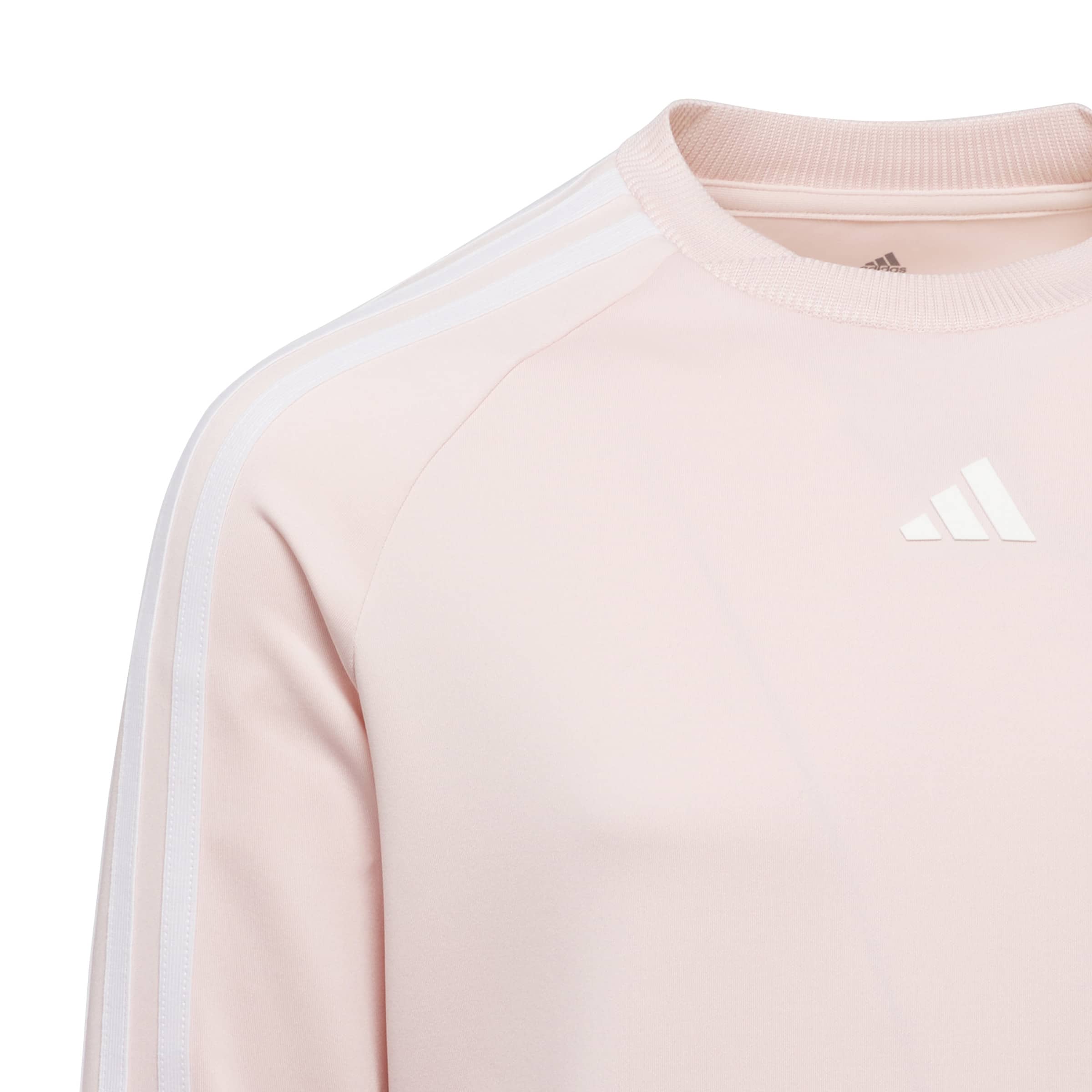 Close up of this girls adidas top, showing the finer details of the adidas 3 stripe logo and the subtle side stripes on the sleeves adn shoulders.