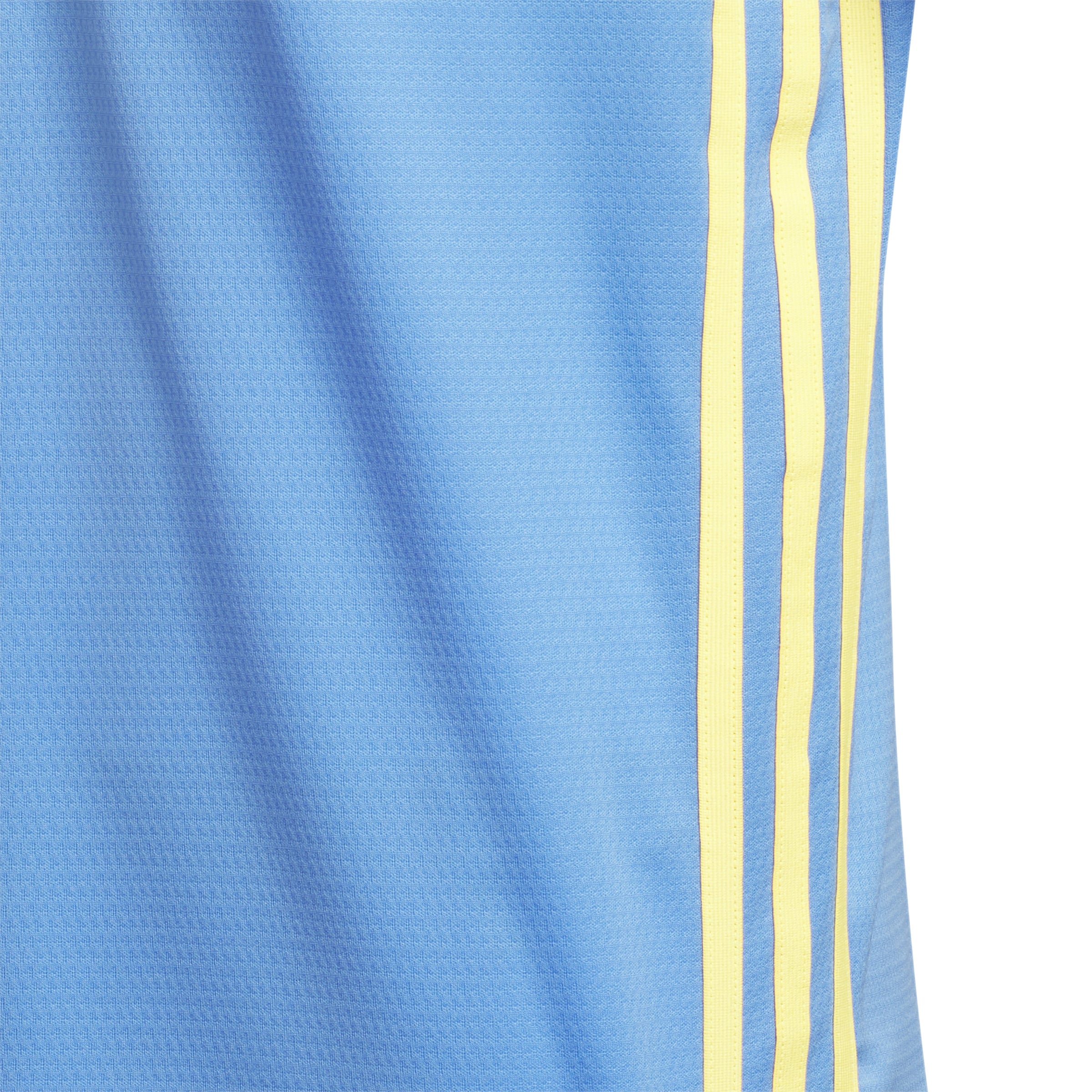 Showing the close up details of the adidas boys polo shirt with the yellow 3 stripe contrast details on the polo against the bright blue shirt.
