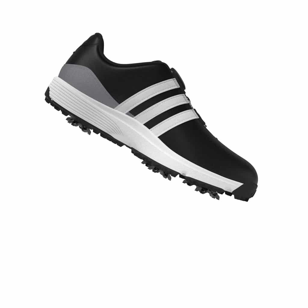 Kids wearing Adidas Tour360 24 BOA Golf Shoes on the green